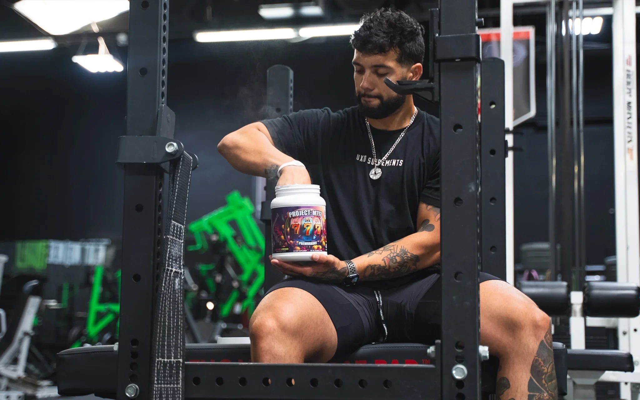 Pre-workout supplement scoop on gym counter — Die Tryin Co. Project M777