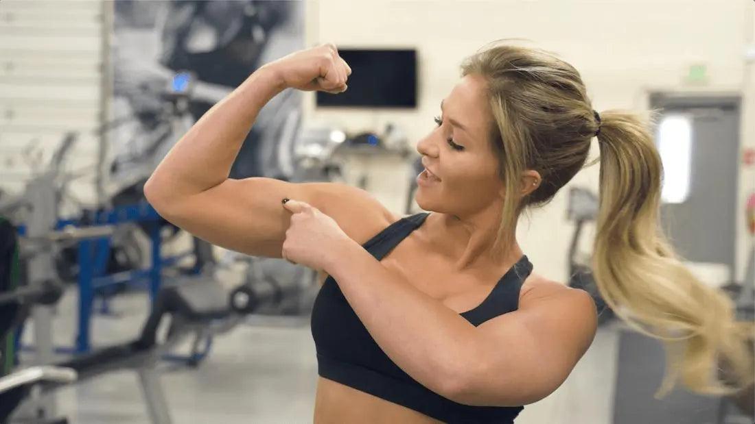Jenna Fiscus performing cable curls during her arms and abs workout